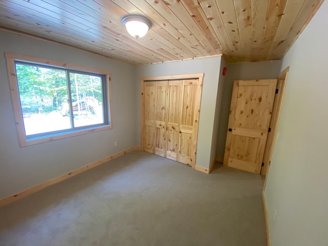 3450 23rd Ave NW, Hackensack, MN 56452 - unfurnished bedroom featuring light carpet, a closet, baseboards, and wooden ceiling