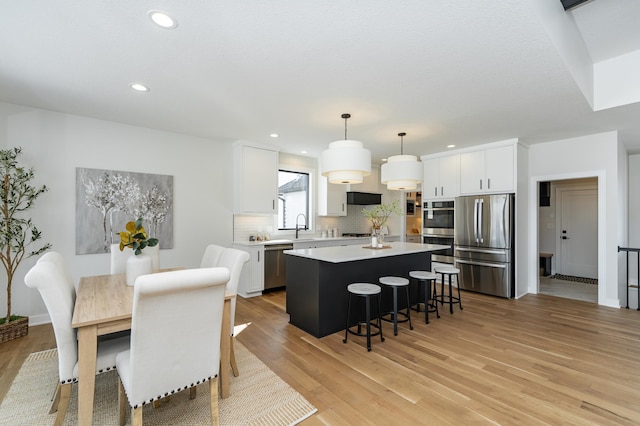 2665 Timber Oaks Rd SW, Rochester, MN 55902 - dining space featuring light wood finished floors and recessed lighting