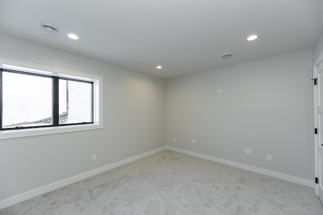 2665 Timber Oaks Rd SW, Rochester, MN 55902 - empty room featuring light colored carpet, recessed lighting, and a smoke detector