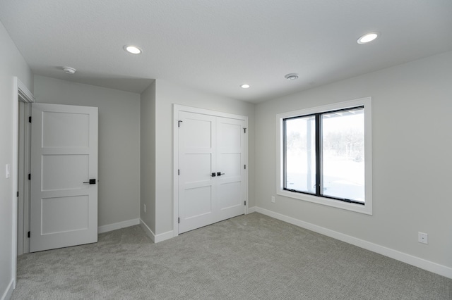 2665 Timber Oaks Rd SW, Rochester, MN 55902 - unfurnished bedroom featuring carpet, recessed lighting, and a closet