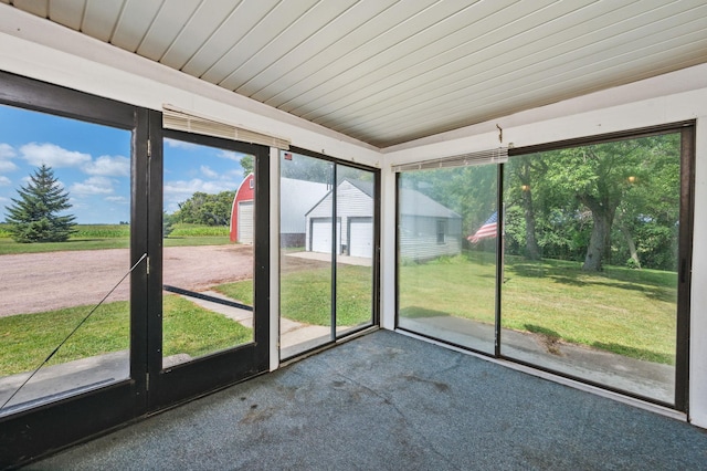 unfurnished sunroom featuring wooden ceiling