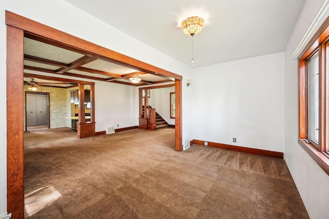 interior space with beamed ceiling, stairway, carpet, and coffered ceiling