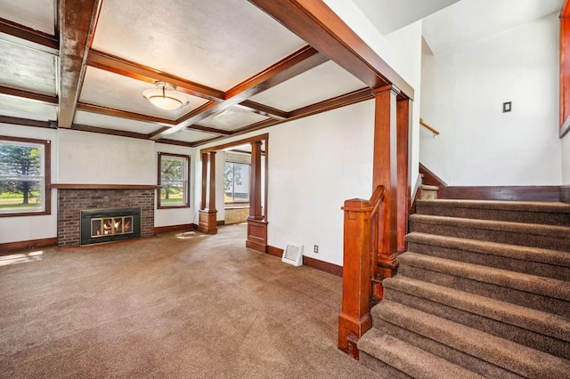 living room with a healthy amount of sunlight, carpet, coffered ceiling, and beam ceiling