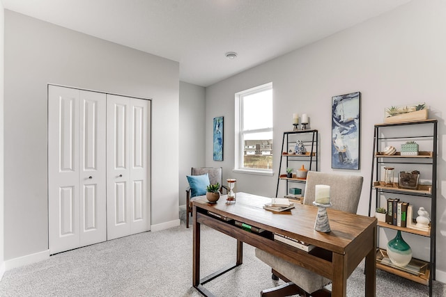 office featuring light carpet and baseboards