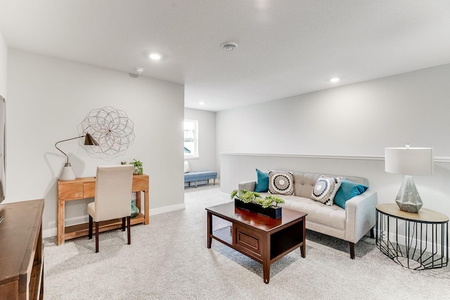 living area featuring recessed lighting, baseboards, and light colored carpet