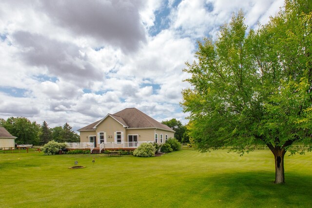 view of yard featuring a wooden deck