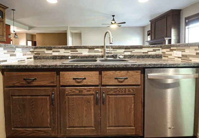 kitchen featuring stainless steel dishwasher, ceiling fan, sink, and backsplash