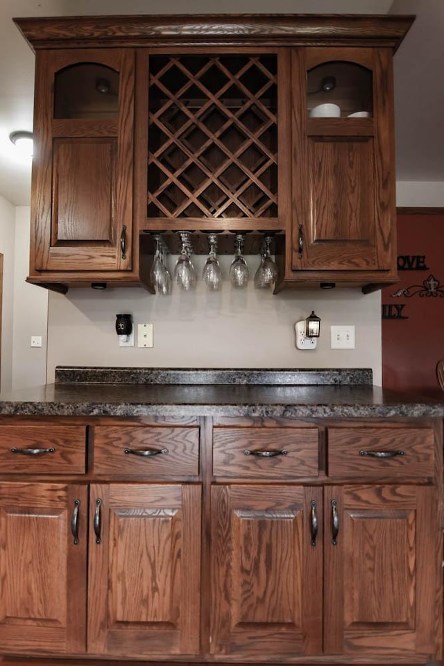 bar featuring dark stone counters