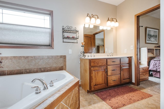 bathroom featuring vanity, tile patterned flooring, and tiled bath