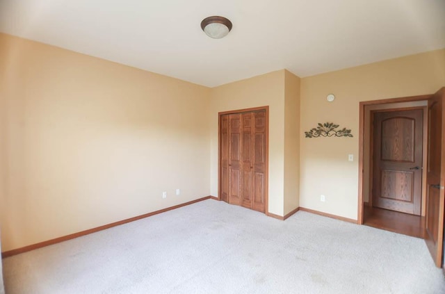 unfurnished bedroom featuring a closet and carpet