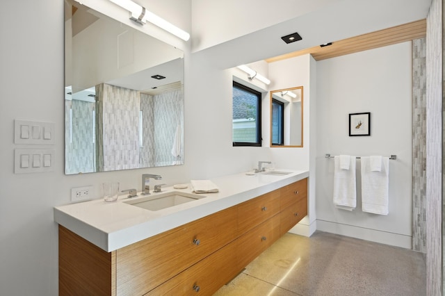 bathroom featuring a shower and vanity