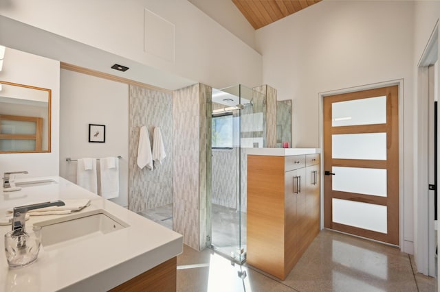 bathroom featuring high vaulted ceiling, vanity, a shower with door, and wooden ceiling