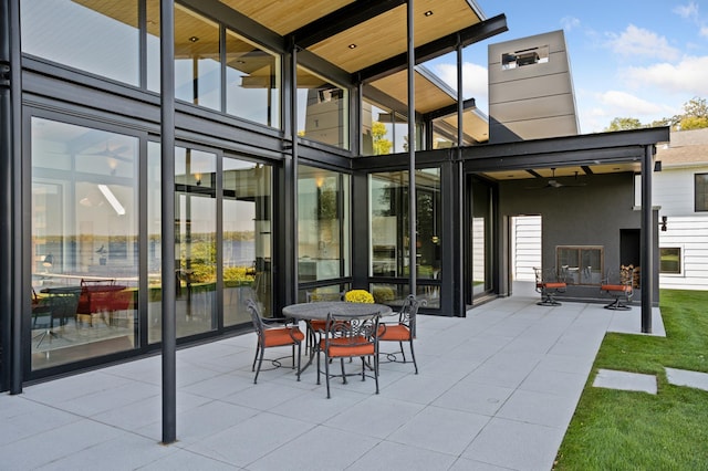 view of patio featuring ceiling fan