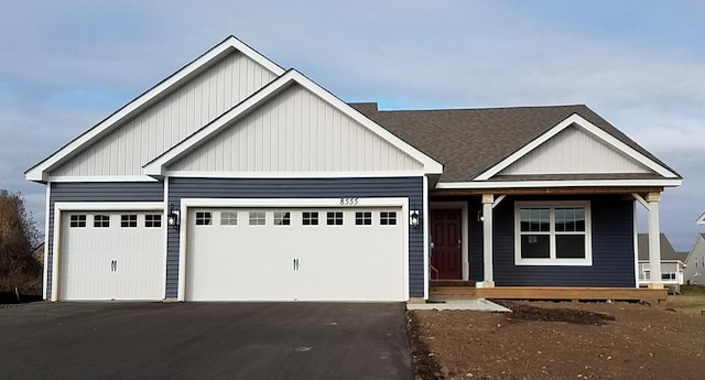 craftsman-style home featuring a garage and covered porch