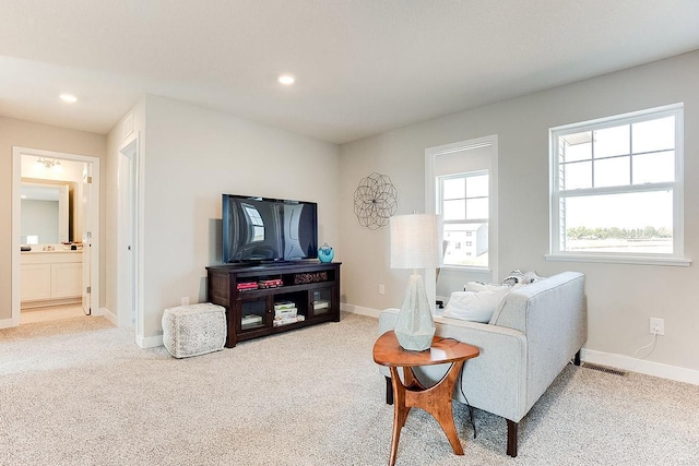 living area with carpet floors, recessed lighting, and baseboards