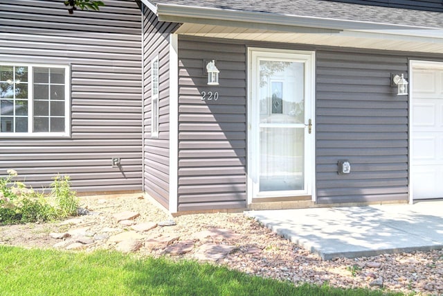 property entrance featuring a garage