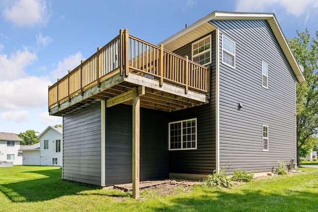 back of house with a lawn