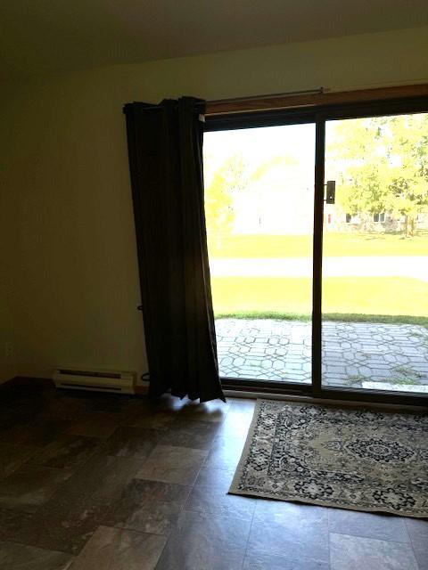 entryway featuring a baseboard heating unit