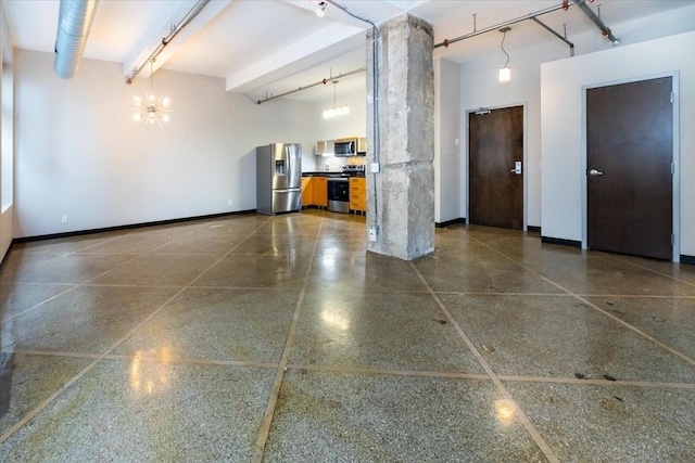 garage with stainless steel fridge