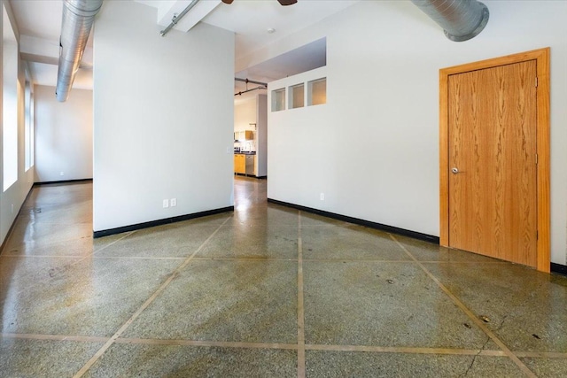 unfurnished room featuring ceiling fan