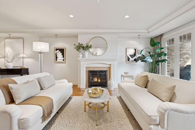 living room featuring hardwood / wood-style flooring and ornamental molding