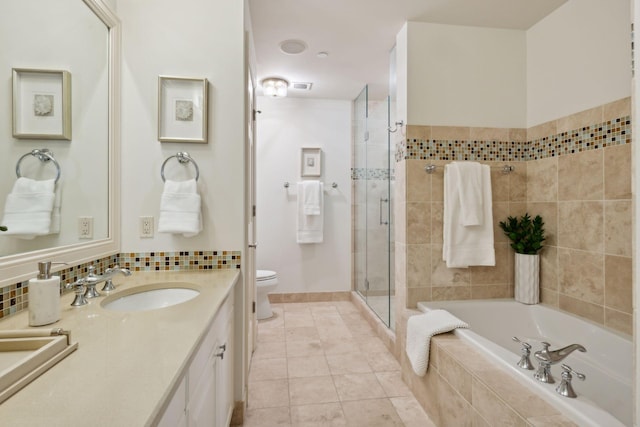 full bathroom with shower with separate bathtub, vanity, tile patterned floors, and toilet