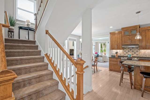 stairway featuring wood-type flooring