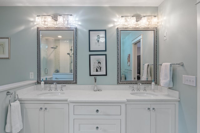 bathroom featuring vanity and an enclosed shower