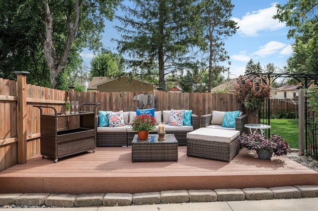 view of patio with an outdoor living space and a wooden deck