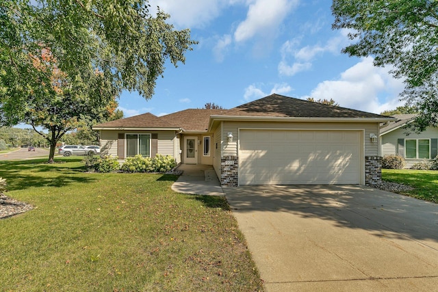 ranch-style house featuring a front lawn and a garage