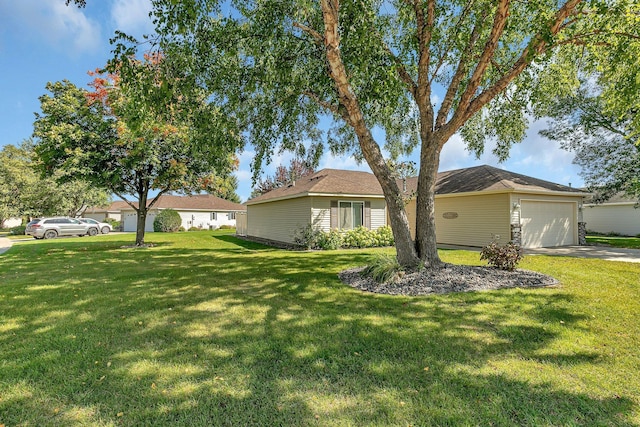 view of front of home featuring a garage and a front lawn