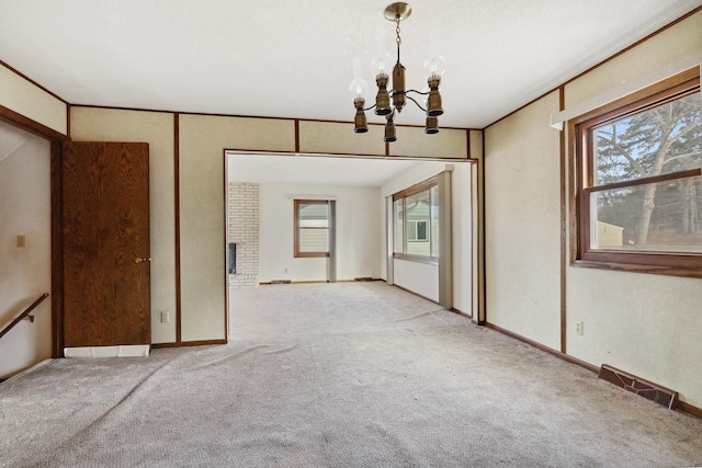 interior space featuring a chandelier and a healthy amount of sunlight