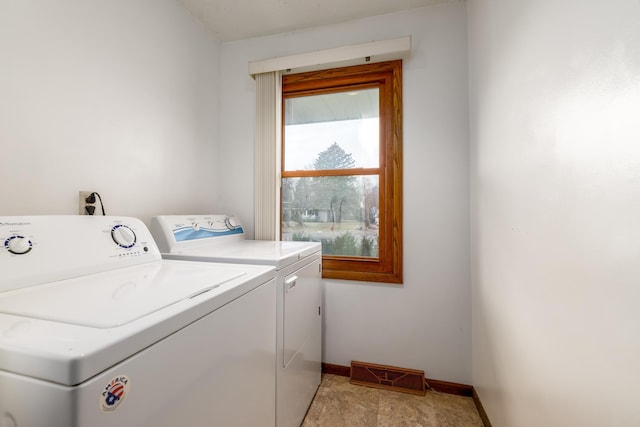 washroom featuring washer and dryer