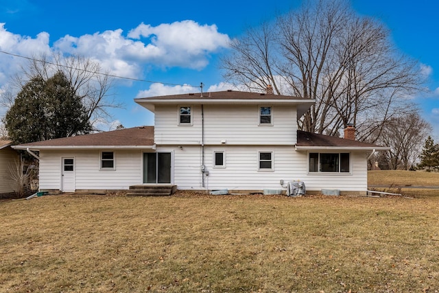 back of house featuring a yard