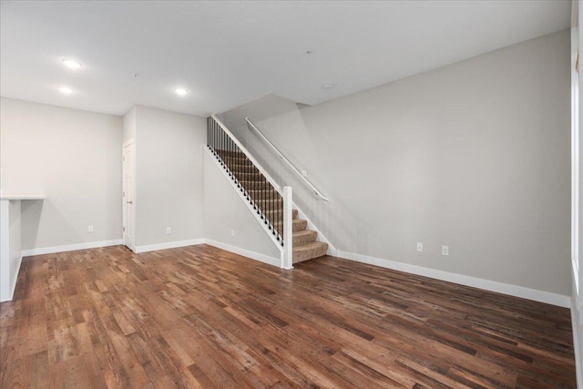 unfurnished living room featuring dark hardwood / wood-style flooring