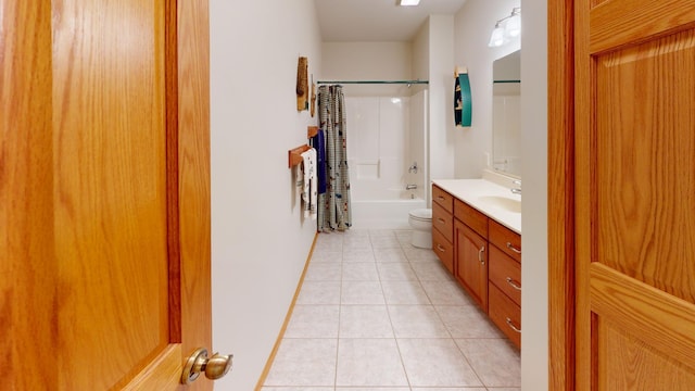 bathroom with toilet, bathing tub / shower combination, vanity, and tile patterned floors