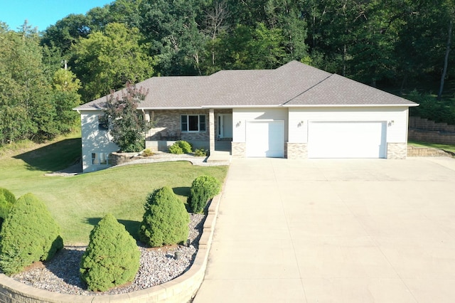 ranch-style house featuring an attached garage, driveway, stone siding, roof with shingles, and a front lawn