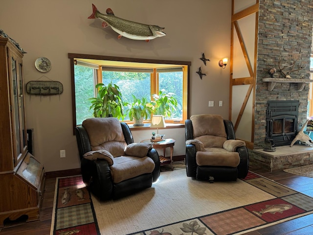 living area featuring baseboards and hardwood / wood-style floors