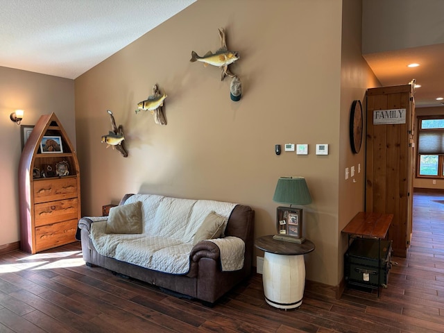 living room with recessed lighting, baseboards, and hardwood / wood-style floors