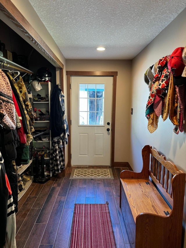 mudroom featuring hardwood / wood-style floors and a textured ceiling