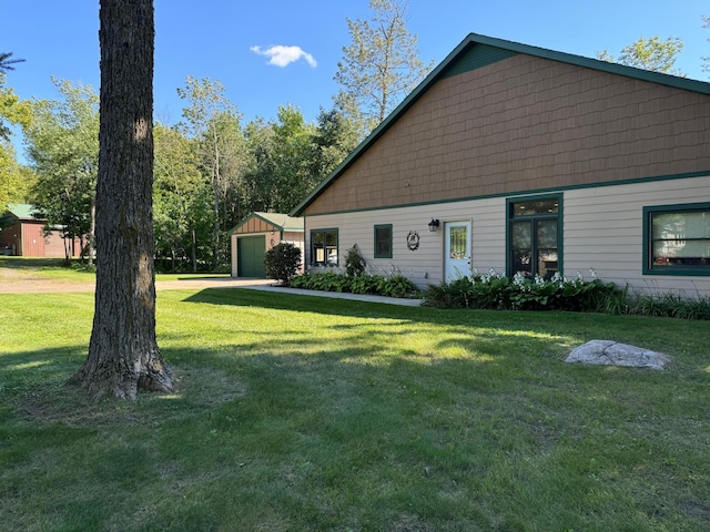 view of front of home with a front lawn and a garage