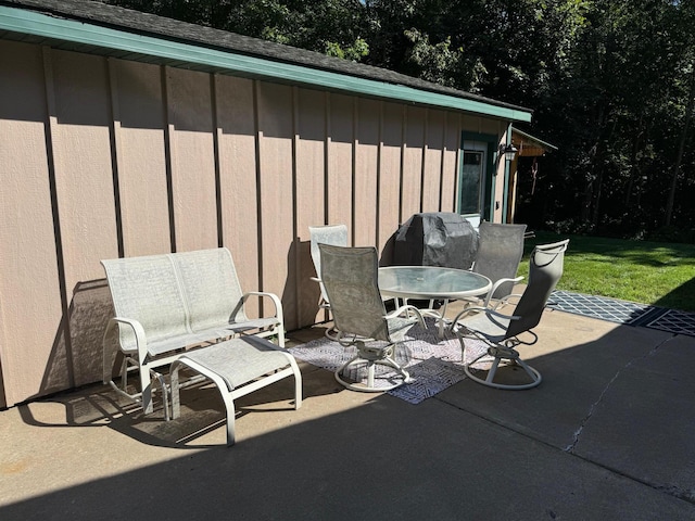 view of patio featuring outdoor dining area