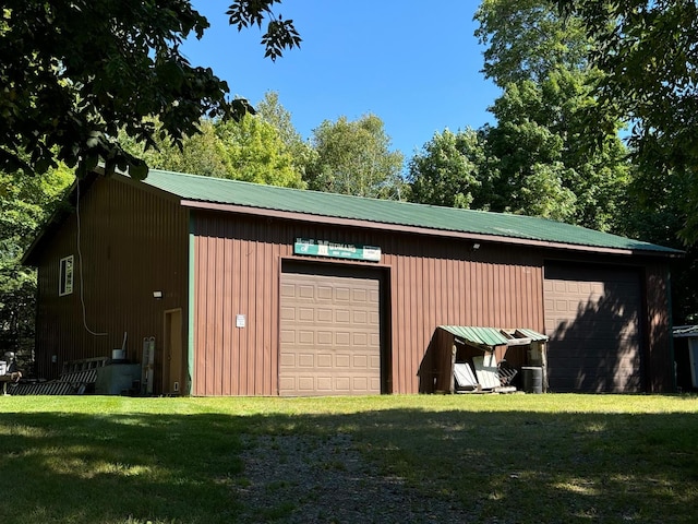 detached garage featuring central AC