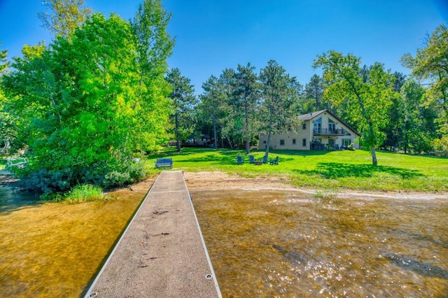 view of home's community with a yard