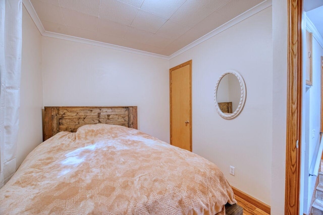 bedroom with crown molding