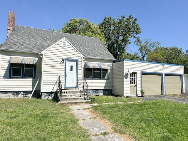 view of front facade with a garage and a front yard