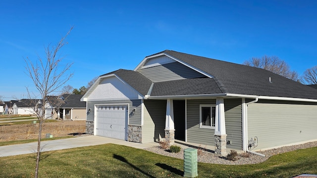 view of front of home featuring a garage, a porch, and a front yard