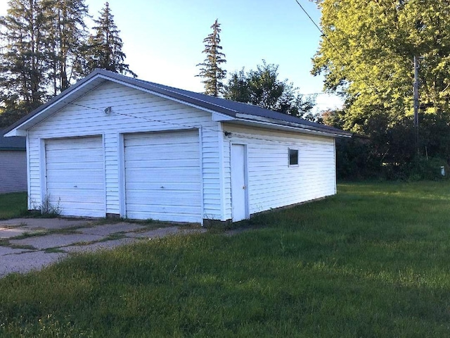 garage with a yard