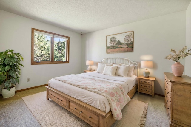 carpeted bedroom featuring a textured ceiling