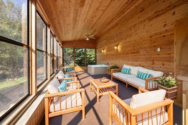 sunroom / solarium with wooden ceiling, ceiling fan, plenty of natural light, and vaulted ceiling